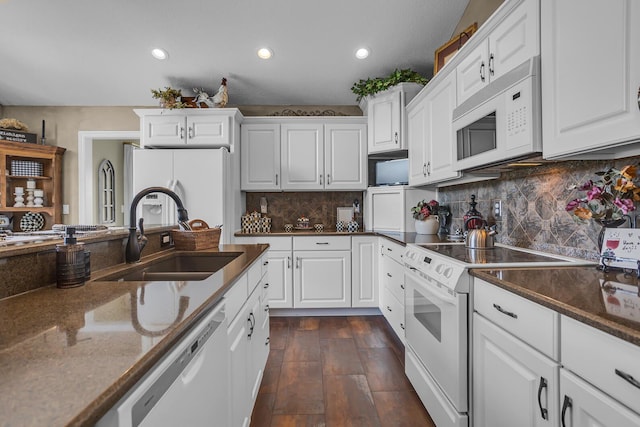 4284 Fairway Ln, Jackson, MI 49201 - kitchen with white cabinets, a sink, white appliances, recessed lighting, and backsplash