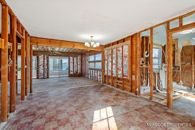 misc room with an inviting chandelier