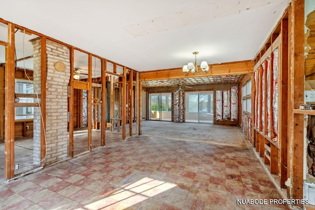 miscellaneous room with a chandelier and tile patterned floors