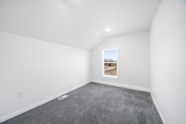 10282 7 Mile Rd, Evart, MI 49631 - bonus room with carpet flooring, baseboards, lofted ceiling, and visible vents