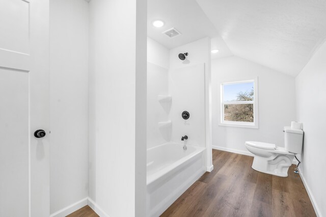 10282 7 Mile Rd, Evart, MI 49631 - bathroom with baseboards, lofted ceiling, toilet, and wood finished floors