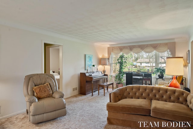 carpeted living area featuring baseboards and visible vents