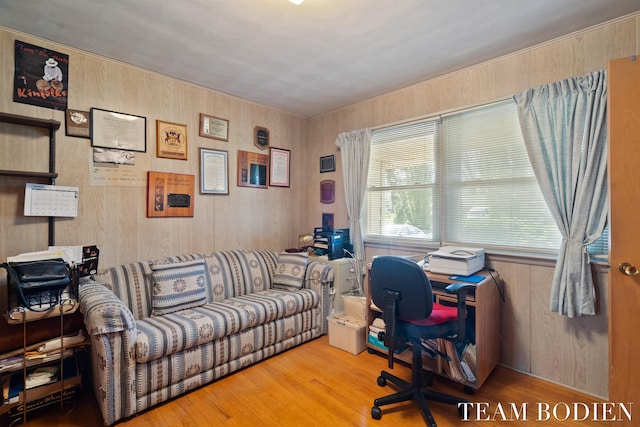 office featuring wood finished floors and wood walls