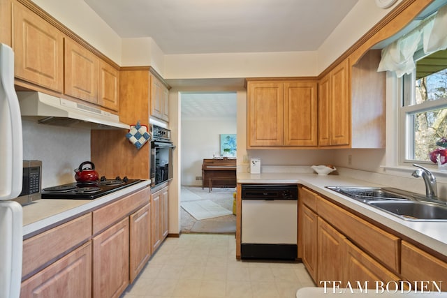 kitchen featuring black electric cooktop, under cabinet range hood, a sink, wall oven, and white dishwasher