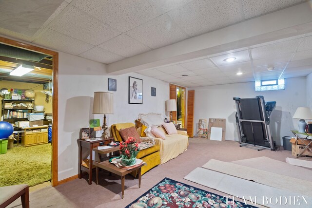 living room featuring recessed lighting, carpet, and a paneled ceiling