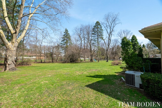 view of yard featuring central AC unit