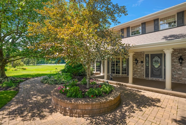 6130 Eidson Rd, Saint Joseph, MI 49085 - porch featuring a yard