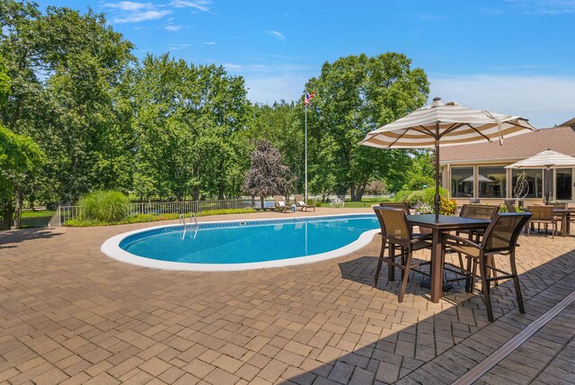 6130 Eidson Rd, Saint Joseph, MI 49085 - view of swimming pool with a patio area and outdoor dining area