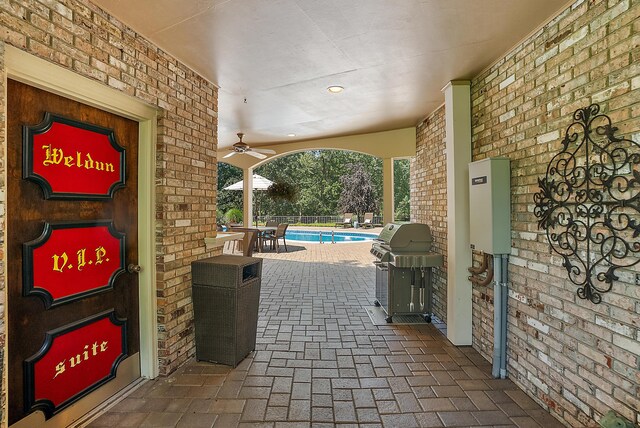 6130 Eidson Rd, Saint Joseph, MI 49085 - view of patio featuring a ceiling fan and a grill