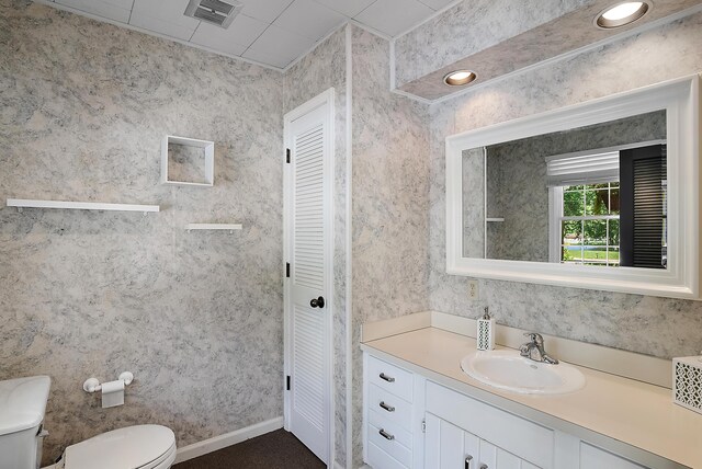 6130 Eidson Rd, Saint Joseph, MI 49085 - bathroom featuring a closet, toilet, and vanity
