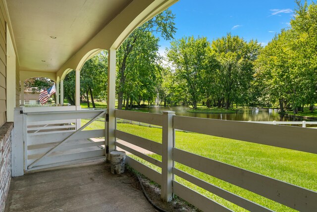 6130 Eidson Rd, Saint Joseph, MI 49085 - porch featuring a water view and view of wooded area