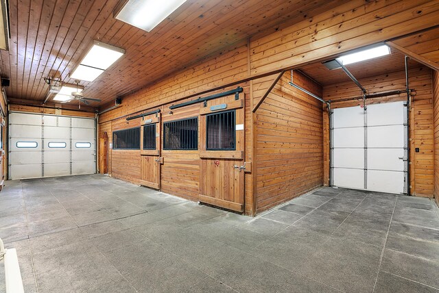 6130 Eidson Rd, Saint Joseph, MI 49085 - garage featuring wooden walls
