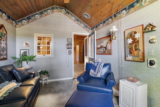 6130 Eidson Rd, Saint Joseph, MI 49085 - sitting room with vaulted ceiling, finished concrete flooring, wooden ceiling, wallpapered walls, and baseboards