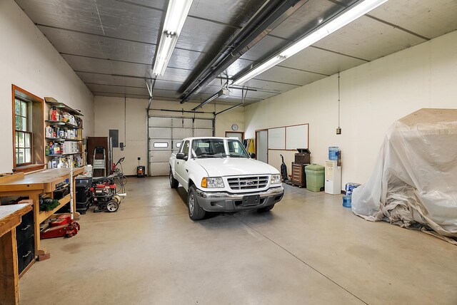 6130 Eidson Rd, Saint Joseph, MI 49085 - garage with a garage door opener and electric panel