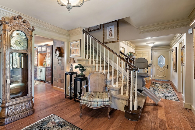 6130 Eidson Rd, Saint Joseph, MI 49085 - foyer entrance with wood finished floors, stairway, ornamental molding, and baseboards
