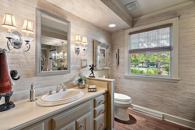 6130 Eidson Rd, Saint Joseph, MI 49085 - bathroom with vanity, toilet, wood finished floors, and a chandelier
