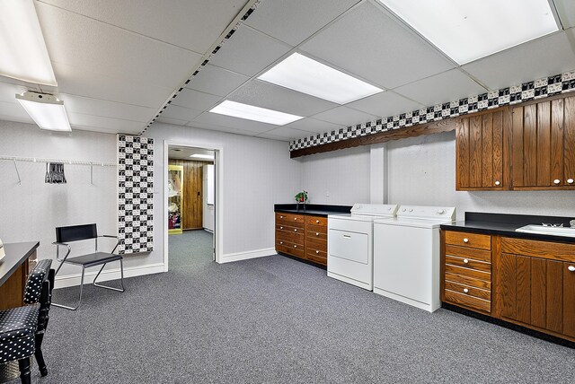 6130 Eidson Rd, Saint Joseph, MI 49085 - kitchen featuring independent washer and dryer, an office area, brown cabinetry, dark carpet, and a paneled ceiling