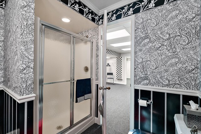 6130 Eidson Rd, Saint Joseph, MI 49085 - bathroom with a stall shower, crown molding, and wallpapered walls
