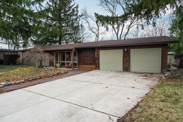 1506 Hillridge Blvd, Ann Arbor, MI 48103 - ranch-style house with an attached garage and driveway