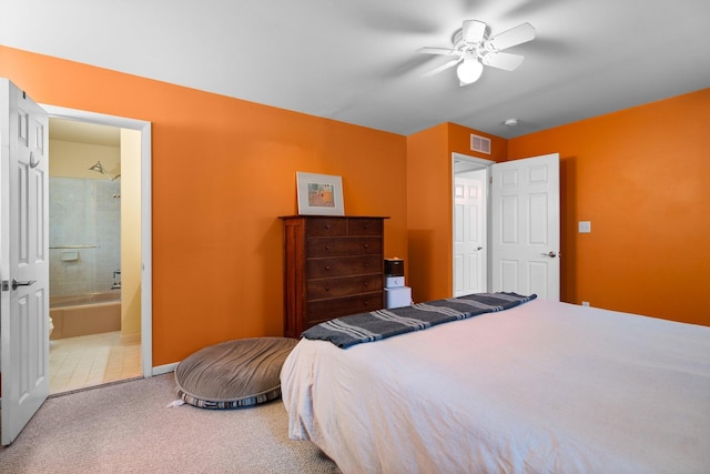 1506 Hillridge Blvd, Ann Arbor, MI 48103 - carpeted bedroom with ensuite bath, visible vents, baseboards, and ceiling fan