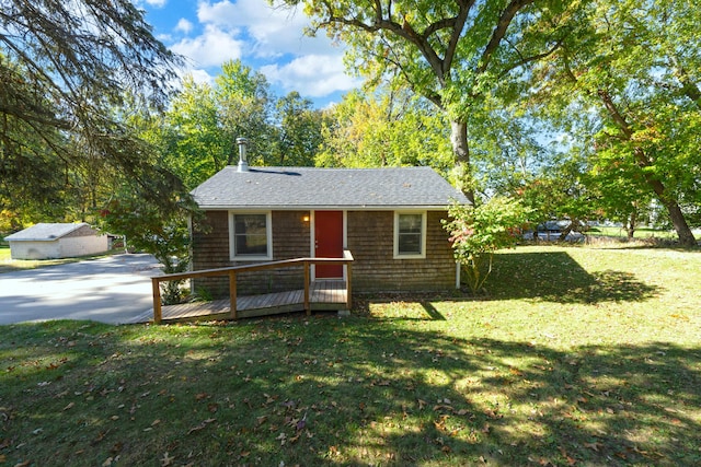 306 Eubank St, Novi, MI 48377 - view of front of home featuring a front yard, a wooden deck, and a shingled roof