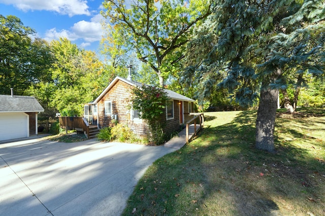 306 Eubank St, Novi, MI 48377 - view of side of home with a wooden deck, concrete driveway, a lawn, and a garage