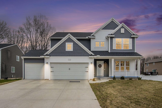 7434 Bramling Dr SE, Caledonia, MI 49316 - view of front facade with a front lawn, concrete driveway, a garage, and covered porch