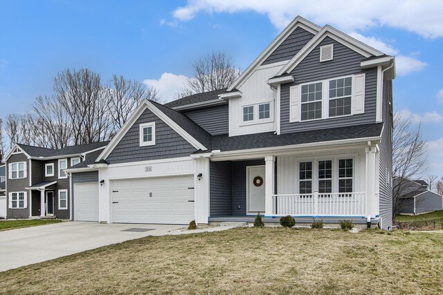 7434 Bramling Dr SE, Caledonia, MI 49316 - traditional home with a front yard, covered porch, a garage, board and batten siding, and driveway