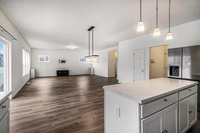 7434 Bramling Dr SE, Caledonia, MI 49316 - kitchen featuring open floor plan, light countertops, stainless steel fridge, and dark wood finished floors