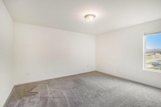 7434 Bramling Dr SE, Caledonia, MI 49316 - carpeted spare room featuring baseboards