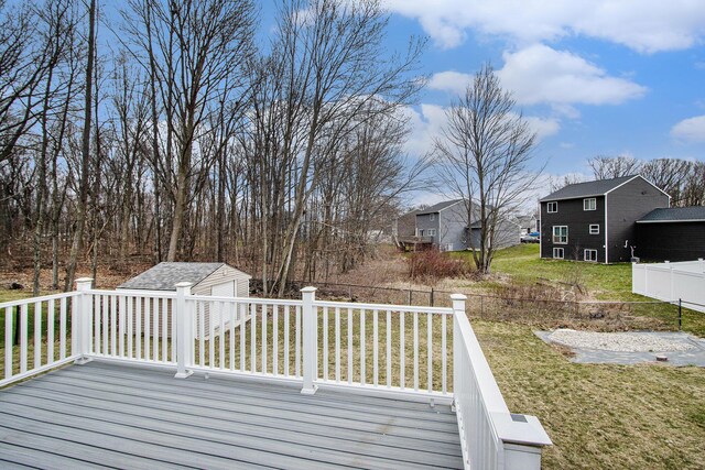 7434 Bramling Dr SE, Caledonia, MI 49316 - deck with a lawn, a residential view, fence, and an outbuilding