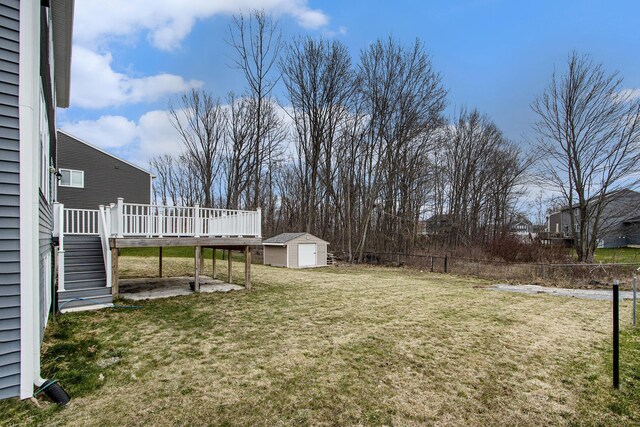 7434 Bramling Dr SE, Caledonia, MI 49316 - view of yard with a storage shed, an outdoor structure, fence, stairway, and a wooden deck