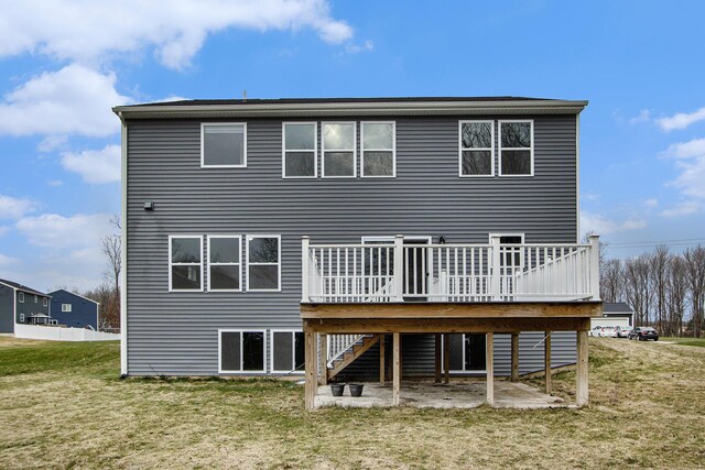 7434 Bramling Dr SE, Caledonia, MI 49316 - rear view of house with a yard, stairway, and a deck