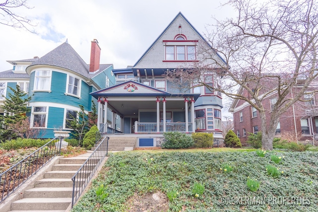 234 Madison Ave SE, Grand Rapids, MI 49503 - victorian house with stairway and covered porch