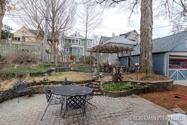 234 Madison Ave SE, Grand Rapids, MI 49503 - view of patio featuring fence and outdoor dining area