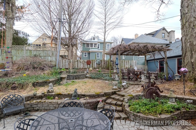 234 Madison Ave SE, Grand Rapids, MI 49503 - view of yard featuring outdoor dining space, a patio, a gazebo, and fence