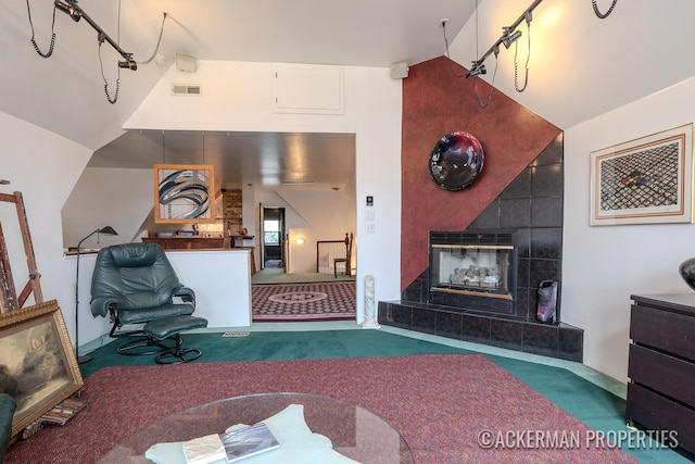 234 Madison Ave SE, Grand Rapids, MI 49503 - living area with a fireplace, carpet flooring, and visible vents