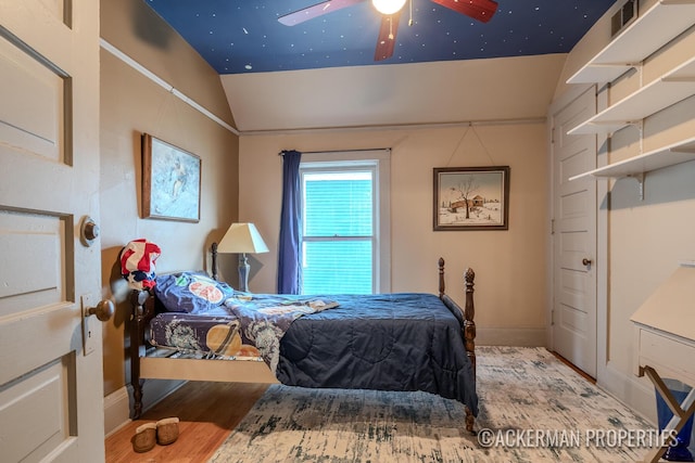 234 Madison Ave SE, Grand Rapids, MI 49503 - bedroom featuring visible vents, baseboards, vaulted ceiling, and wood finished floors