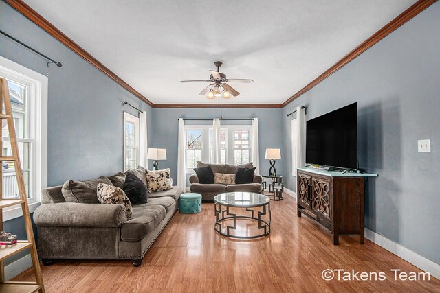 98 W 16th St, Holland, MI 49423 - living area featuring light wood-style floors, baseboards, and a ceiling fan