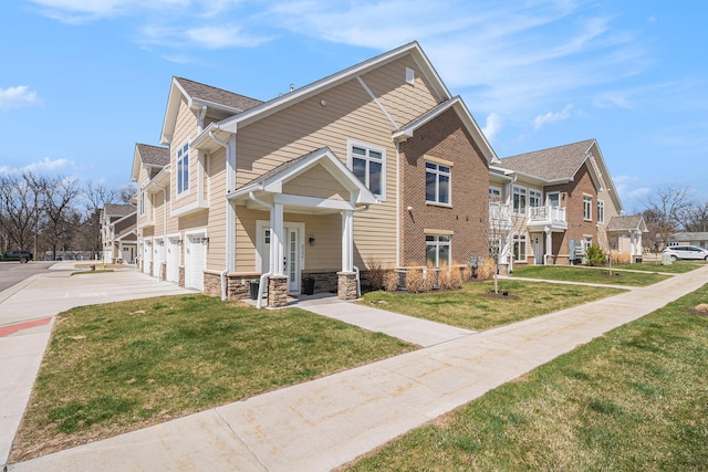 view of front facade featuring an attached garage, a residential view, a front yard, and stone siding