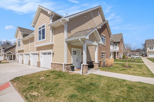 view of front of house with a residential view, driveway, an attached garage, and a front lawn