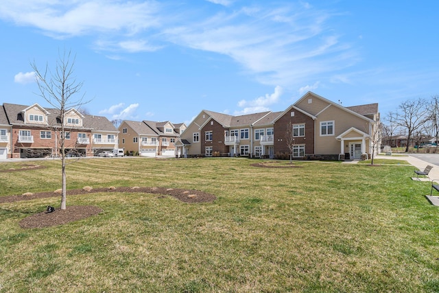 view of front facade with a residential view and a front lawn