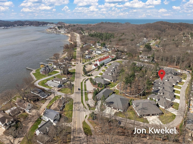 bird's eye view with a water view and a residential view