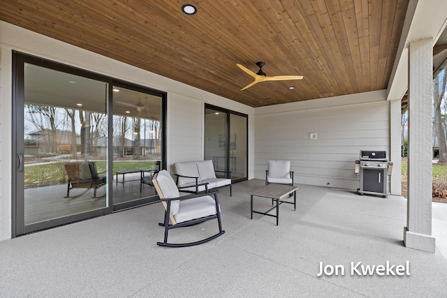 view of patio / terrace with grilling area and a ceiling fan