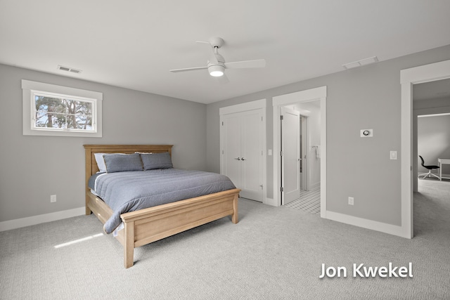 bedroom with light colored carpet, baseboards, and visible vents