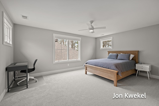 bedroom with visible vents, baseboards, a ceiling fan, and carpet