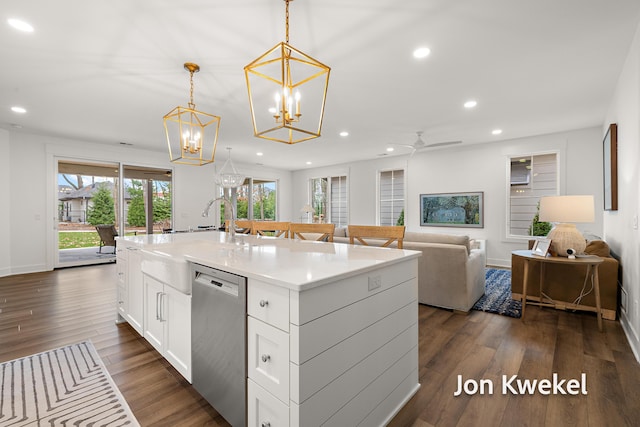 kitchen with white cabinets, open floor plan, dark wood-style floors, recessed lighting, and stainless steel dishwasher