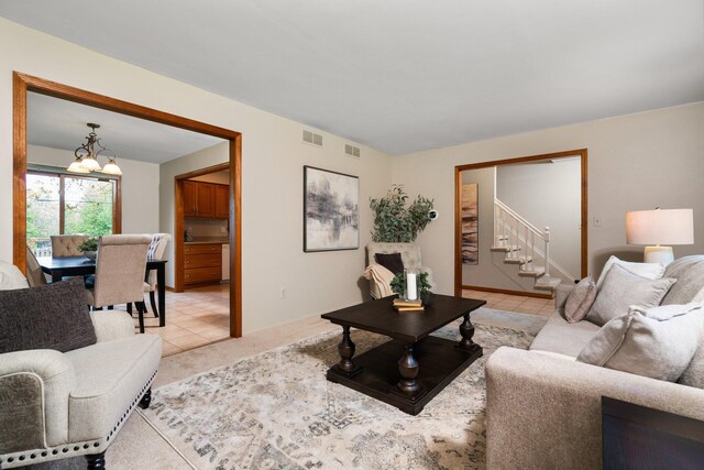 1569 Sheffield Dr, Ypsilanti, MI 48198 - living area featuring stairway and a chandelier