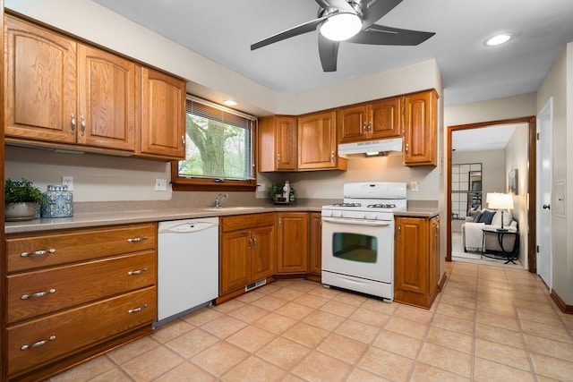 1569 Sheffield Dr, Ypsilanti, MI 48198 - kitchen with white appliances, under cabinet range hood, brown cabinetry, ceiling fan, and recessed lighting