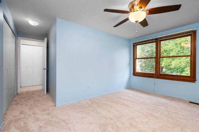 1569 Sheffield Dr, Ypsilanti, MI 48198 - spare room featuring light colored carpet and a ceiling fan